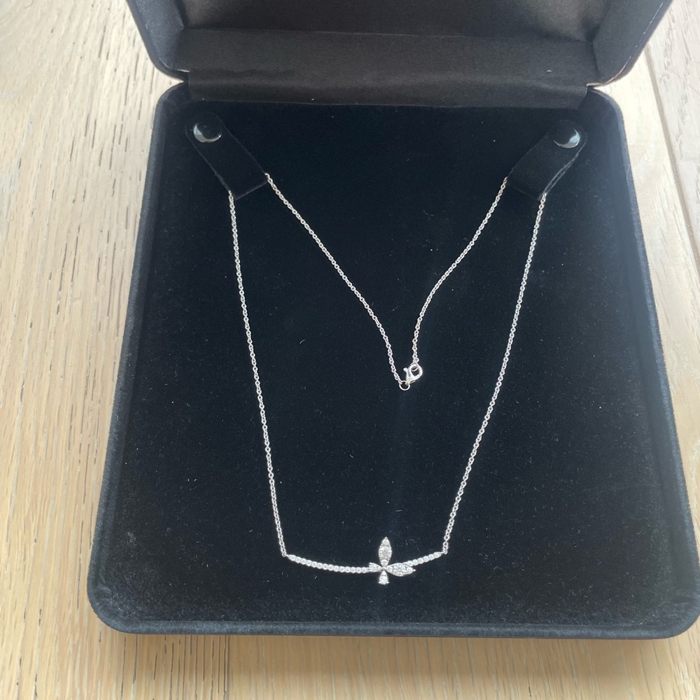 14k white gold and moissanite butterfly bar necklace.